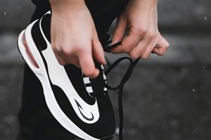 Runner tying shoes